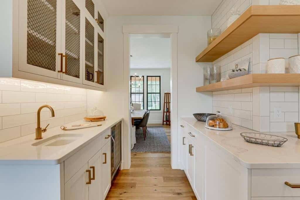 white cabinet butlers pantry with white oak flooring open shelving