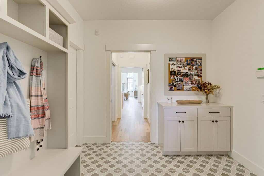 white mudroom tile floor dropzone