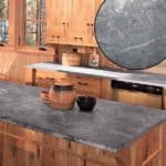unoiled gray soapstone countertop in rustic kitchen