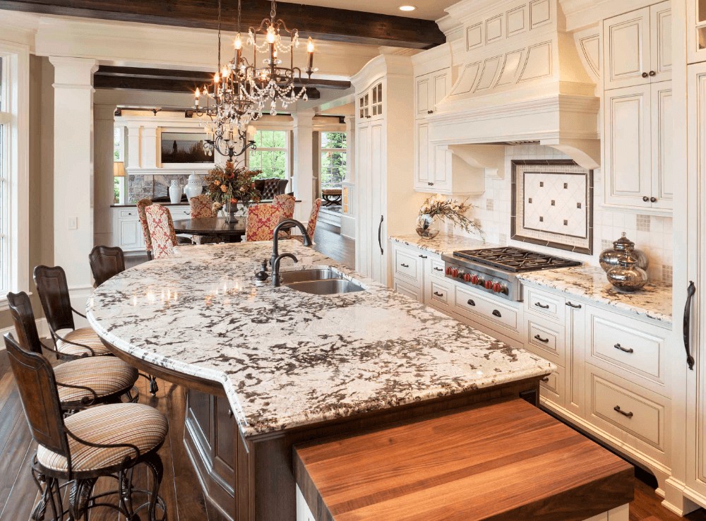 Delicatus White Granite polished countertop in traditional french country cream white kitchen