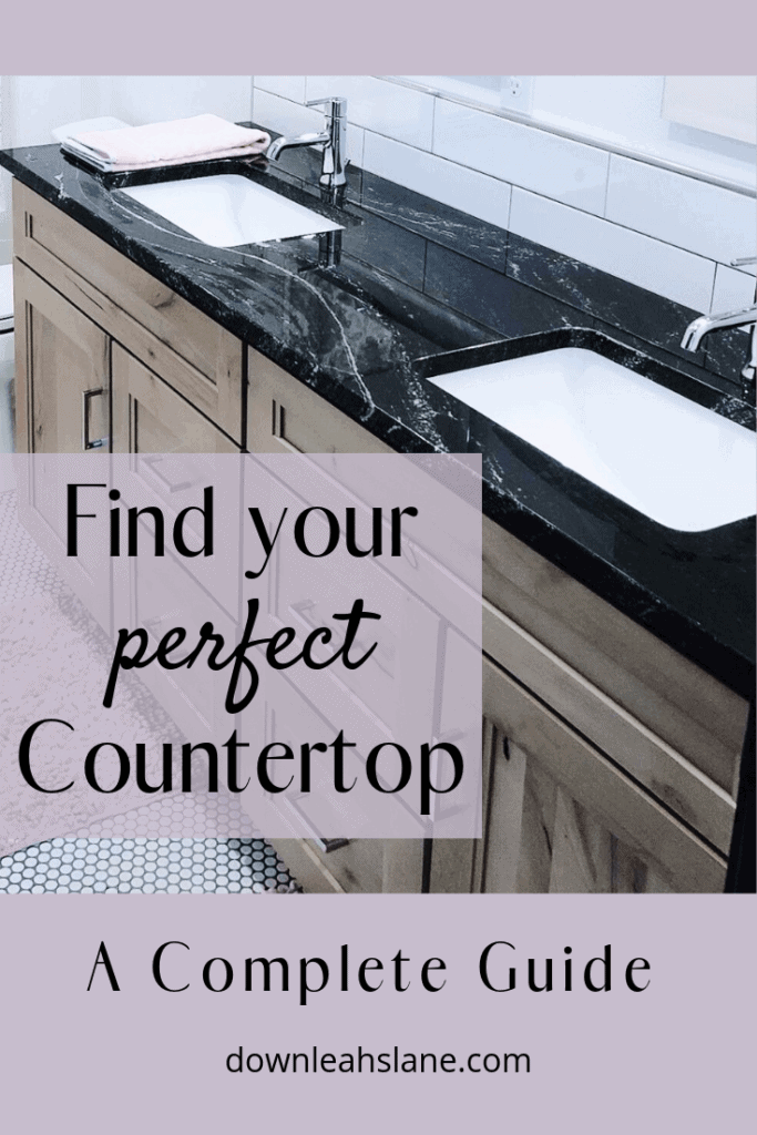 Finding your perfect countertop can be overwhelming, but here's a polished black granite slab with thin swirls of white on this double vanity alder cabinet. All tie in beautifully with the black and white penny tile flooring. Designed by Down Leahs Lane.