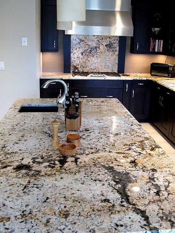 Delicatus White granite is a true statement piece in this kitchen design. With blacks, browns, tans and whites, this countertop can be used with almost any color cabinetry for a traditional to modern style kitchen.