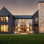 A modern Italian dark farmhouse provides stunning architecture and design ideas. The dark exterior paired with lighter stone showcases the modern lines and windows perfectly. Via John Lively + Associates and Hayes Signature Homes. #downleahslane #modernfarmhouse #italianhouse #modernexterior #darkexterior #darkhouse #blackhouse #blackexterior #modernarchitecture #stoneaccents #dreamhouse #dreamhome #luxuryhouse #luxuryhome
