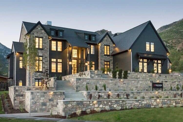 This luxury home features a dark exterior with contrasting stone for a dramatic look any homeowner and architect would dream of. By Raykon Construction. #downleahslane #darkhouse #luxuryhome #blackhouse #darkexterior #stone #dreamhouse #dreamhome #luxuryhouse #stonelandscaping #mansion
